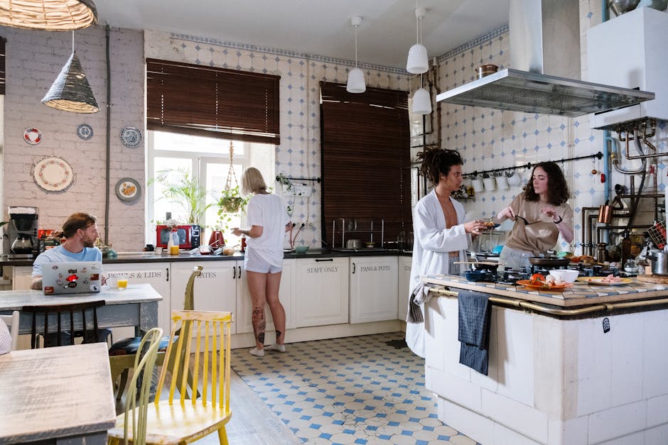 Friends enjoying a cozy day cooking together in a stylish kitchen setting.