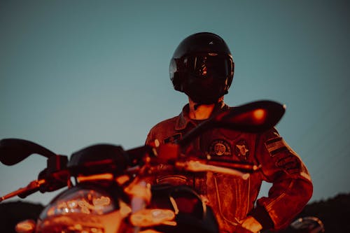 Motorcyclist in Helmet and Jacket in Evening