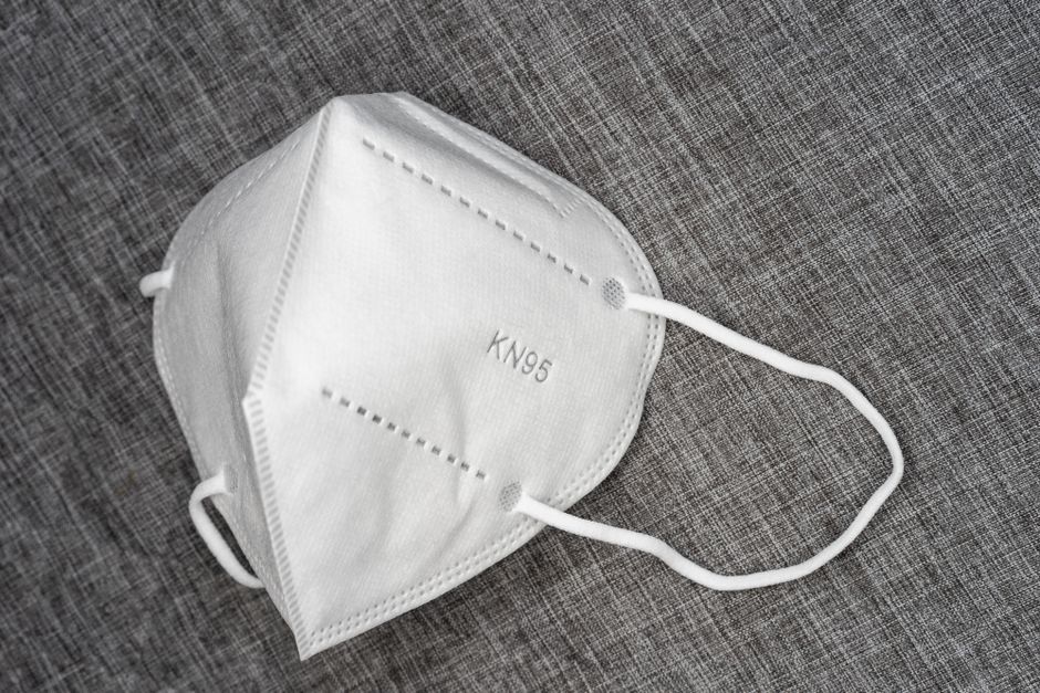 Surgery doctor disposable surgical face mouth mask wearing blue exam gloves
