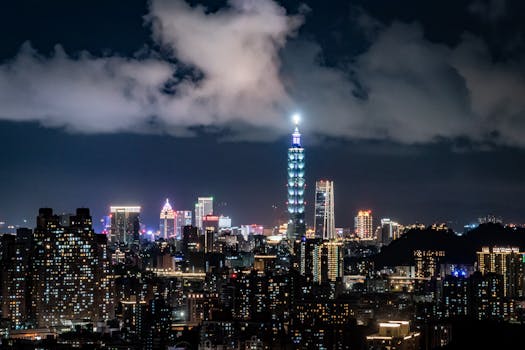 Vibrant skyline of Taipei with the iconic Taipei 101 highlighted at night.