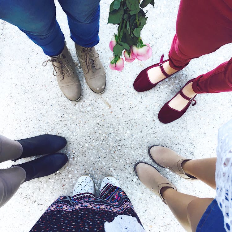 Five Person Wears Footwear at Daytime