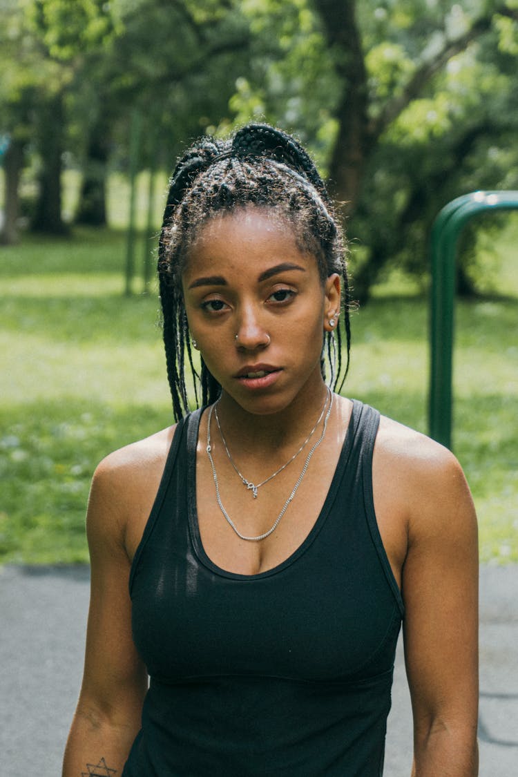 Woman In A Black Tank Top 