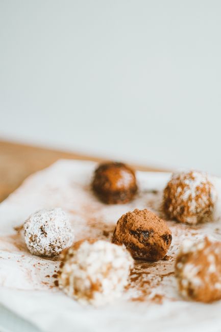 Close-up of homemade chocolate truffles on parchment paper, capturing a delightful dessert scene. - healthy snacks Pakistan