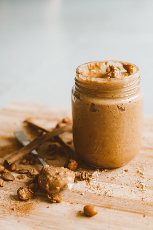 Free Clear Glass Jar With Peanut Butter Stock Photo