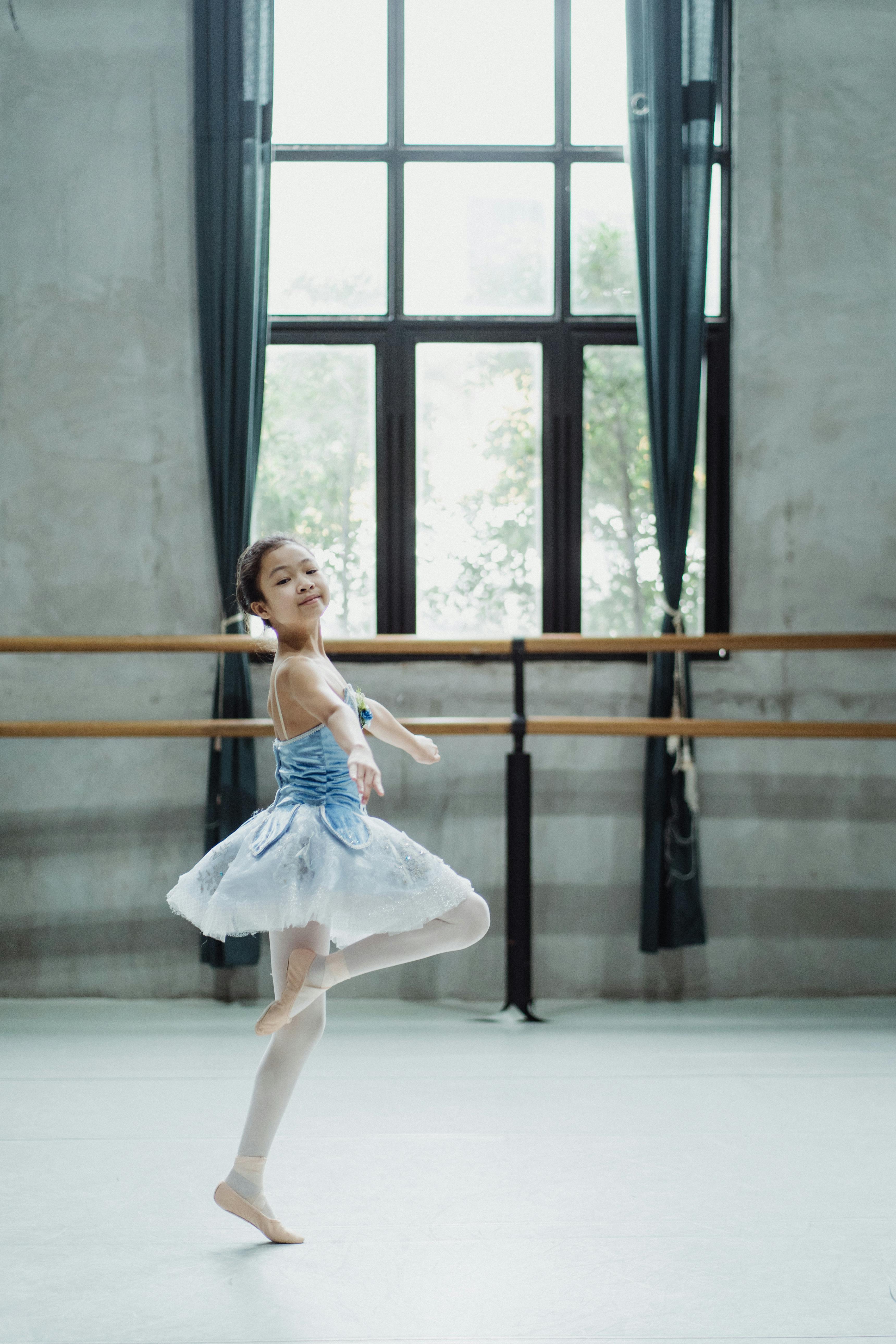 ballerina in pointe dancing in studio