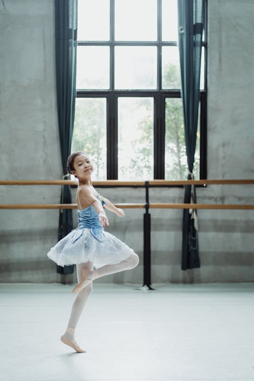 Ballerina in pointe dancing in studio