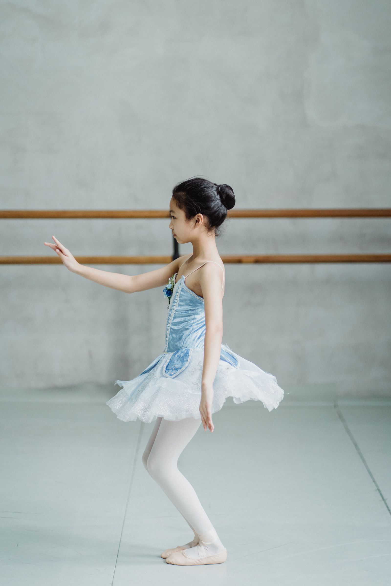 Young girl practising ballet in a studio