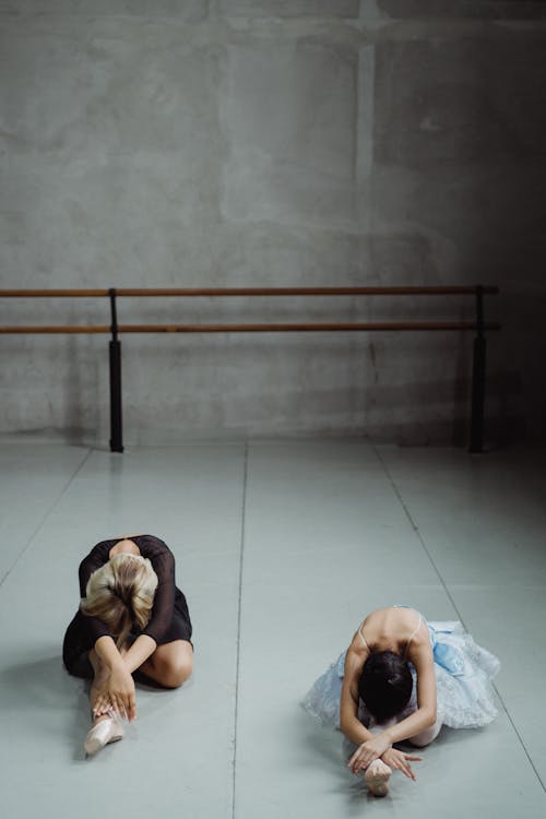 Free Ballet dancers stretching body in studio Stock Photo