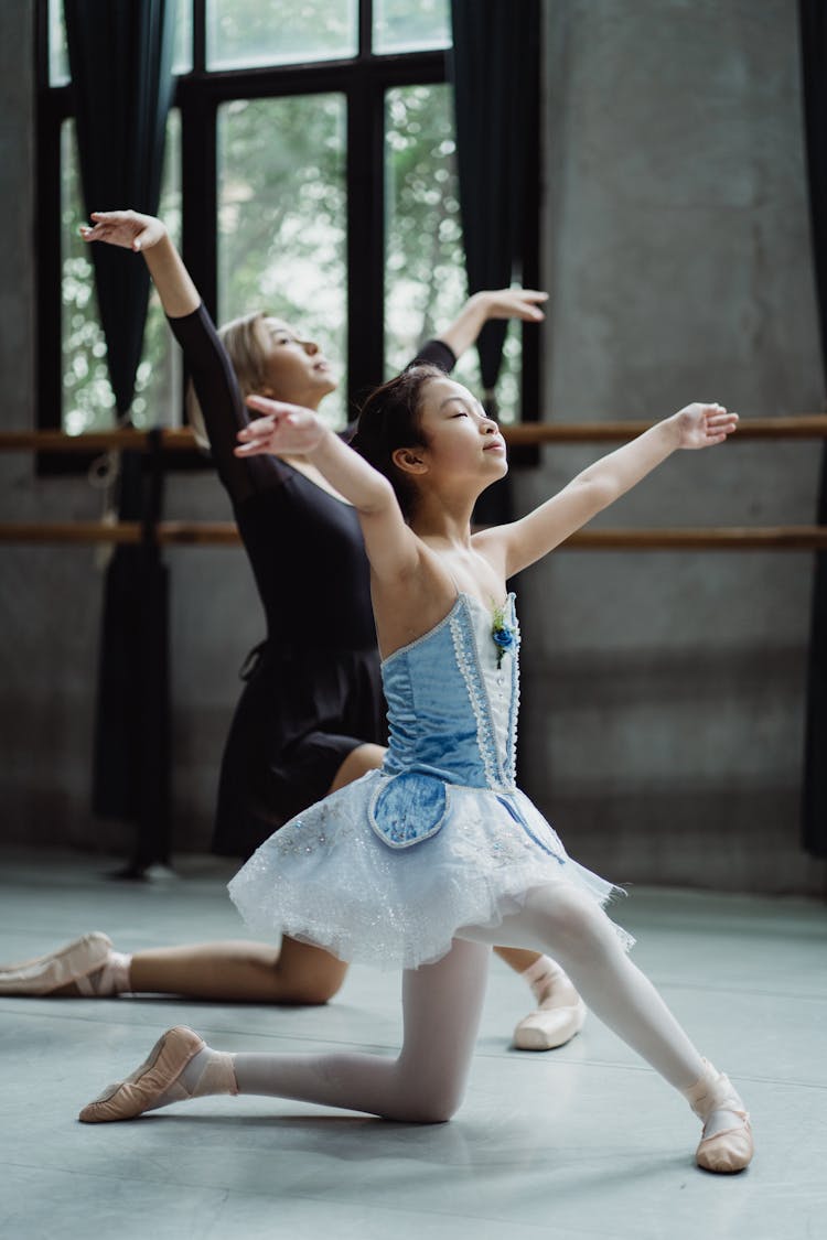 Graceful Asian Ballet Dancer With Girl Learning Dance