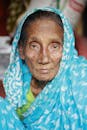Elderly Woman Wearing a Blue Scarf on Head