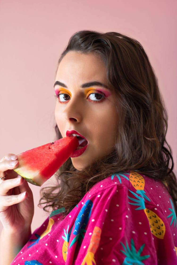 Woman In Pink Printed Shirt Eating Watermelon