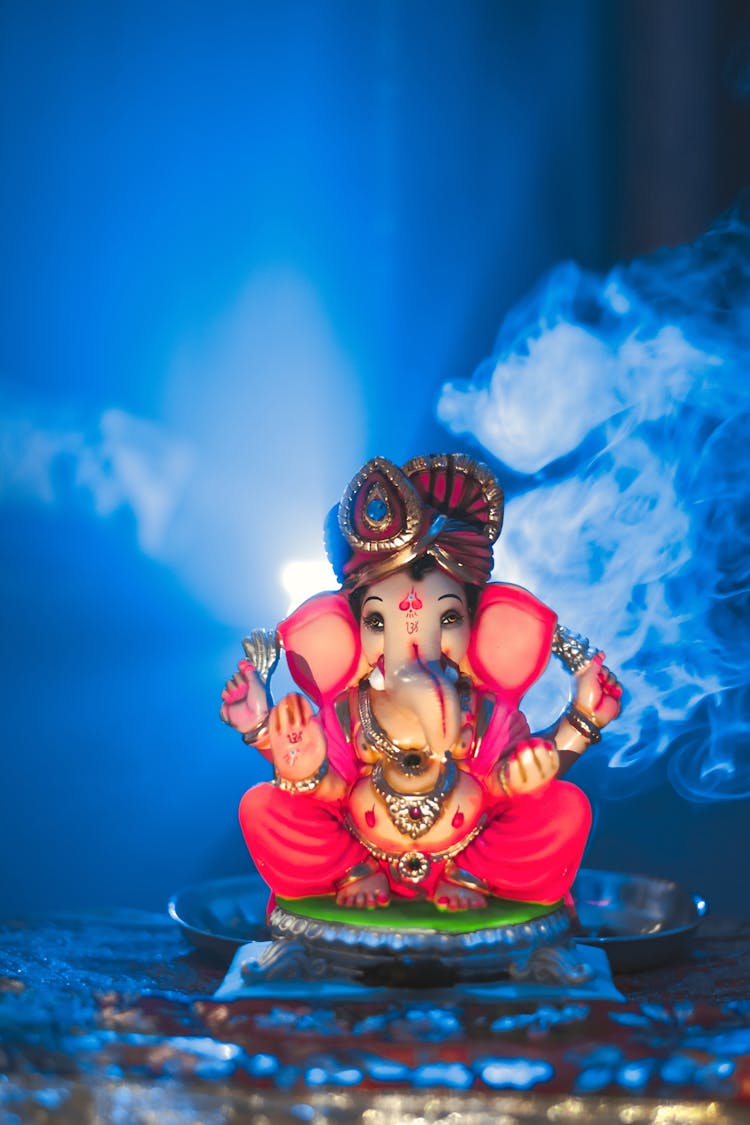 A Ganapati Statue In Pink Color