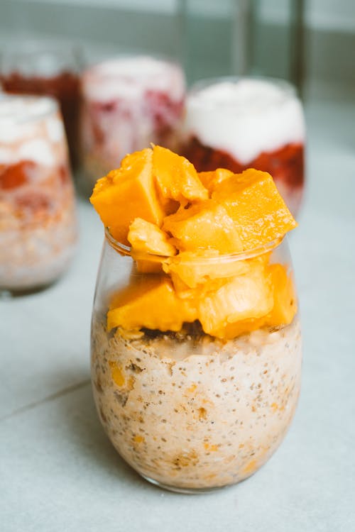 Sliced Fresh Mango in a Glass of Creamy Yoghurt