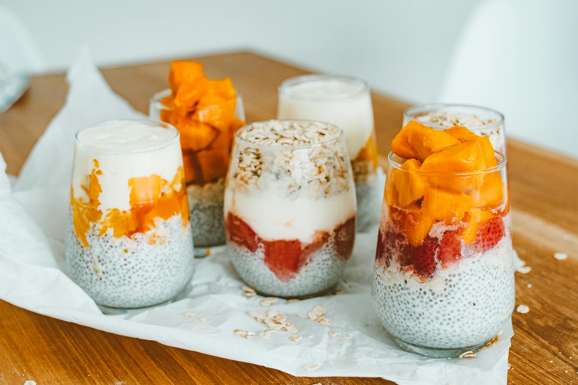 Greek yogurt parfait with fresh fruit and granola in jars