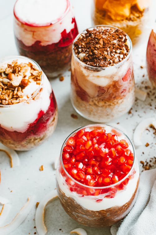 White Ice Cream With Red and Black Berries on Top