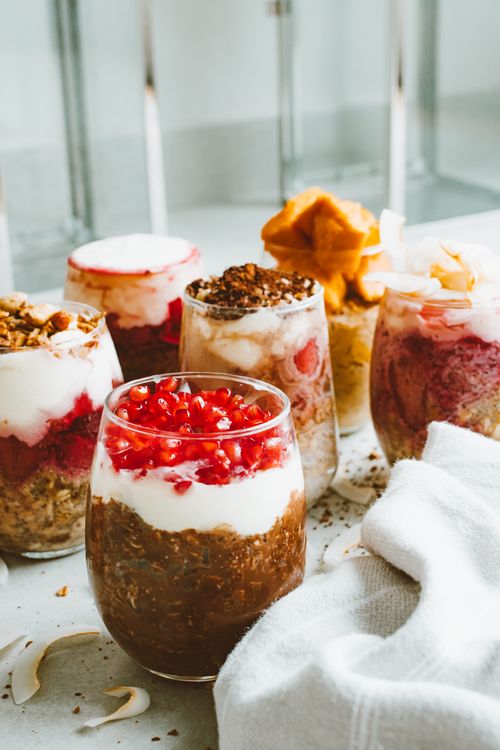 Free Delicious layers of yogurt, fruit, and toppings in elegant glasses for a perfect dessert. Stock Photo