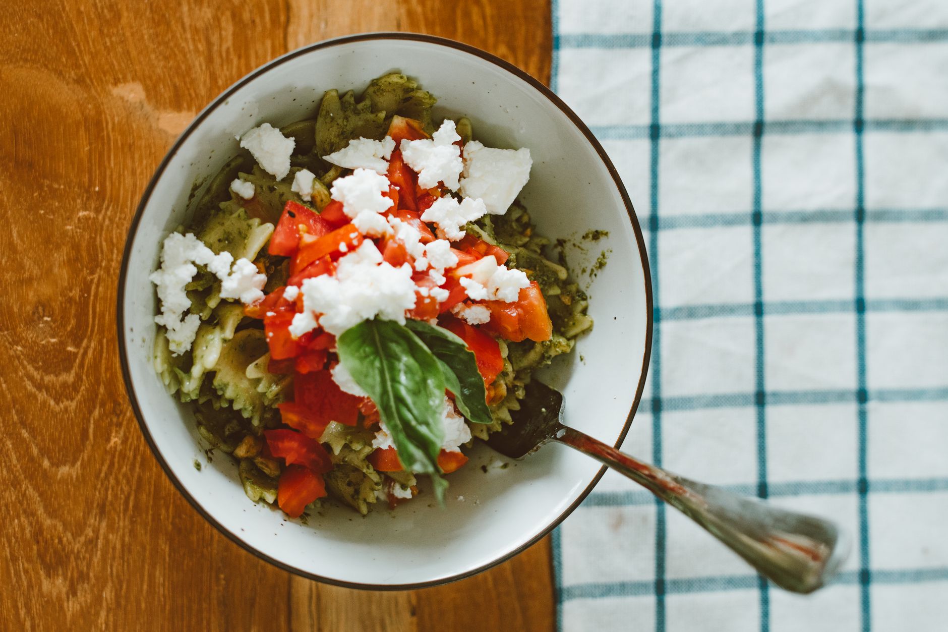 Bowl of Bow Tie Pasta with Pesto, Feta, and Cherry Tomatoes