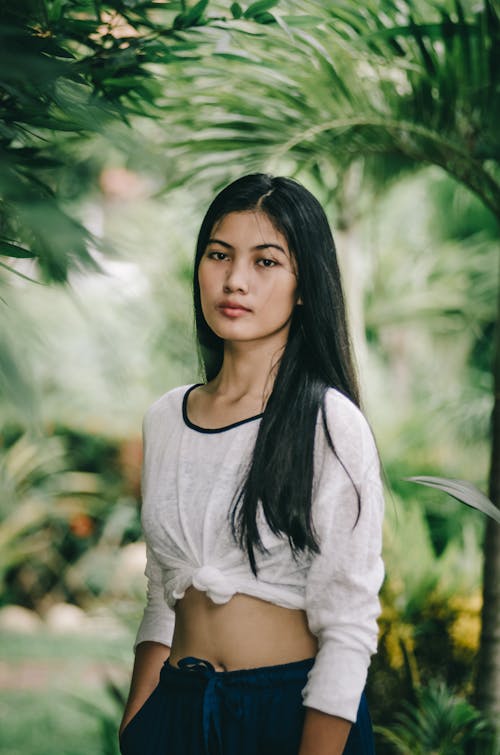 Portrait of a Natural Woman Among Tropical Plants 