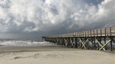 Brown Wooden Dock on Sea Under White Clouds