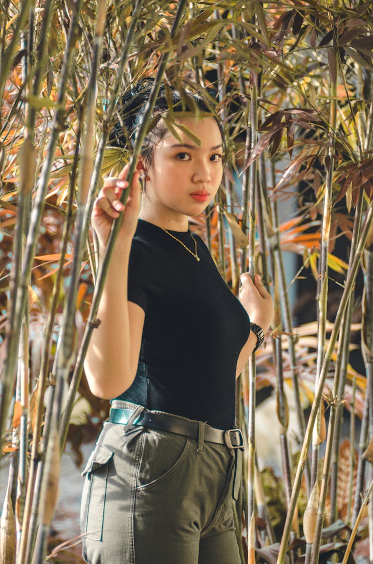 Woman Among Leafy Plants