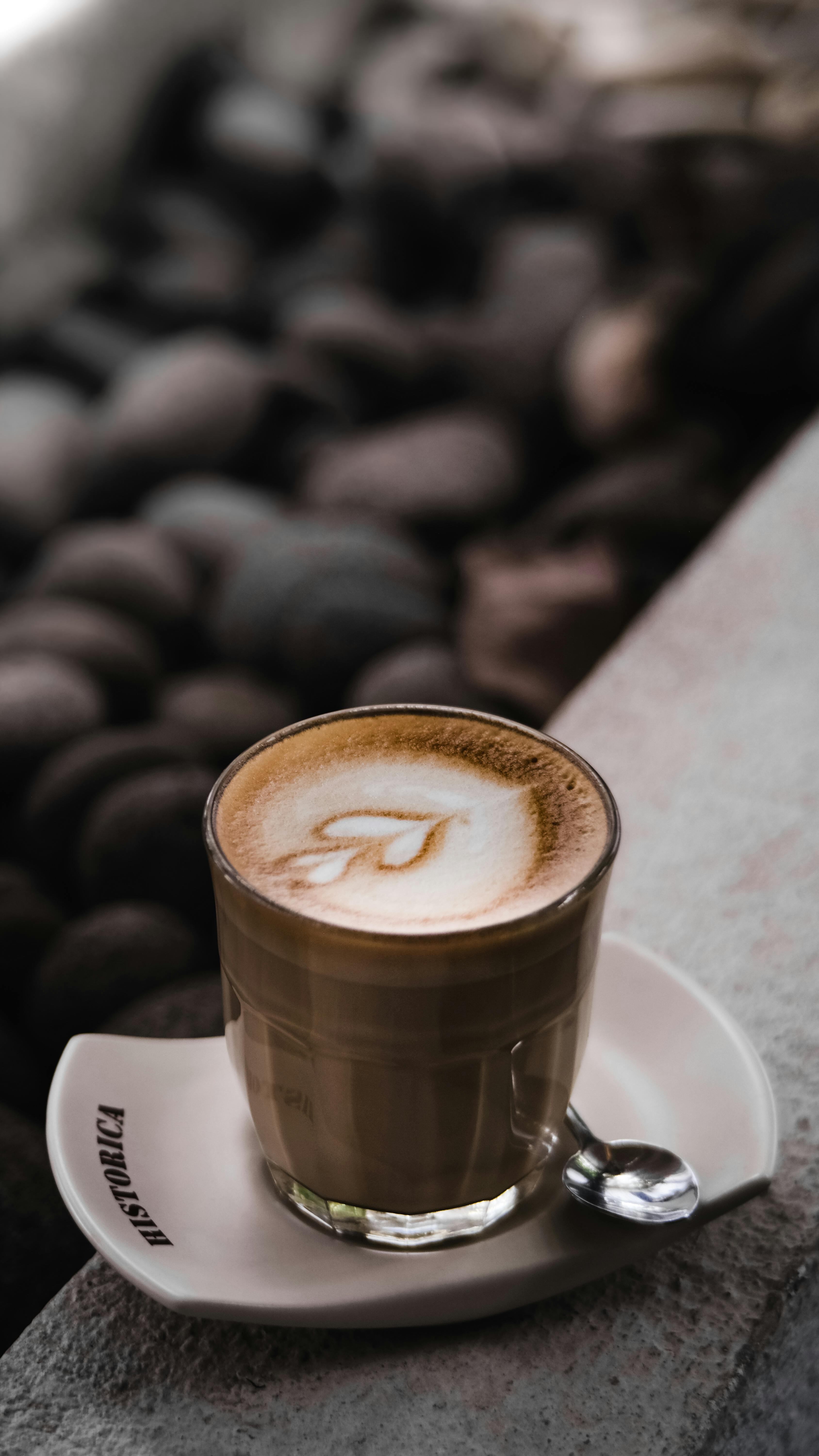 Coffee Latte Near Green Plant · Free Stock Photo