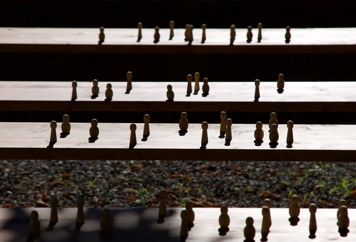 Set of wooden figurines on steps
