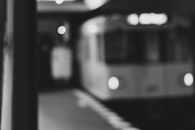 Grayscale Photo of Train in Train Station