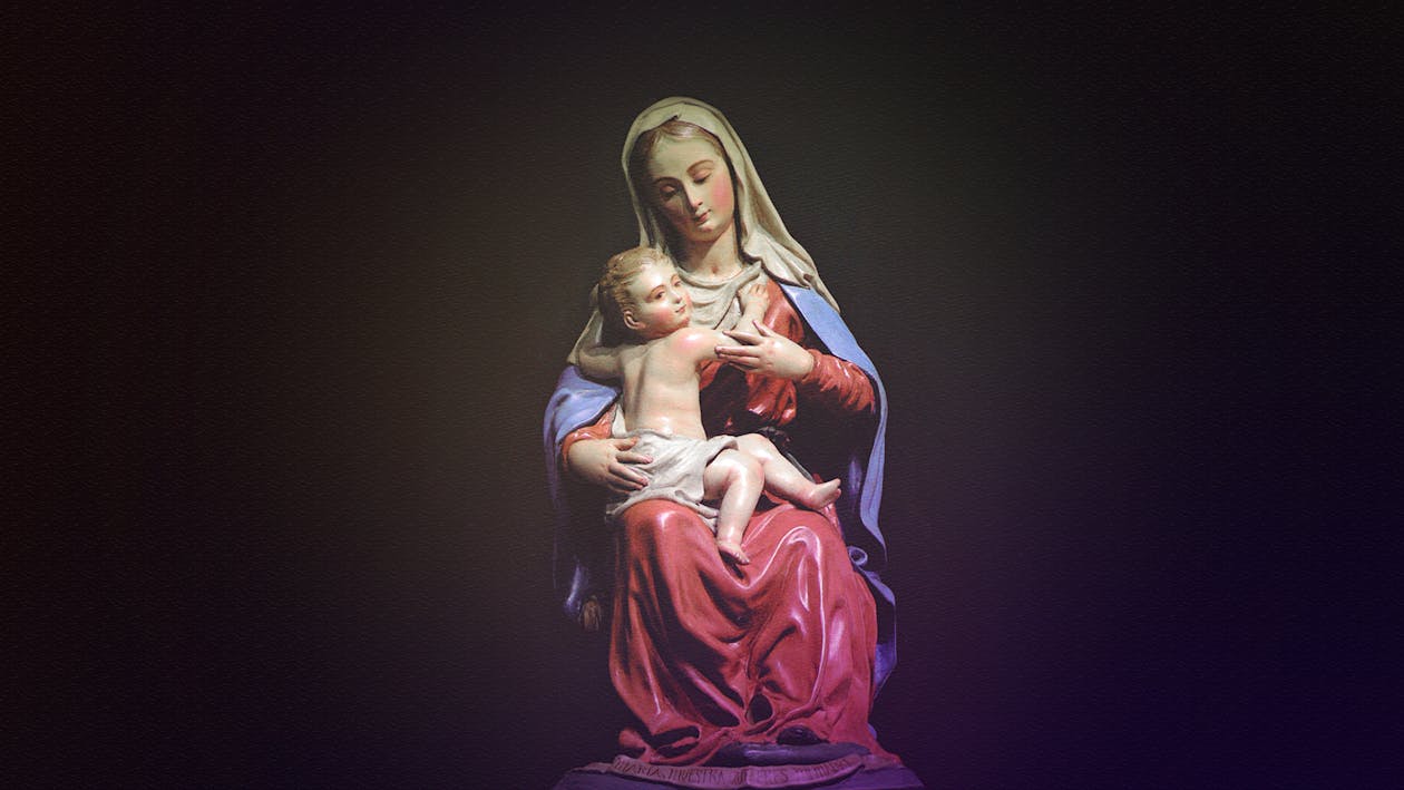 Free Mother Mary and Christ Figurine on Black Background Stock Photo