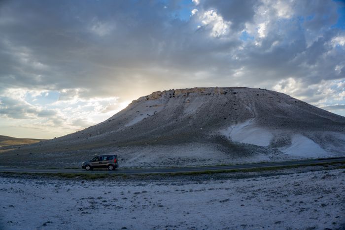 Car on a desert road at sunset — photo by Deniz Ozgur on Pexels