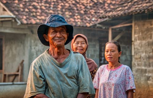 Free Portrait of smiling villagers in Rumpin, West Java, depicting rural life and tradition. Stock Photo