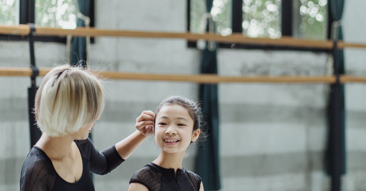 Child smiling during a free trial dance class