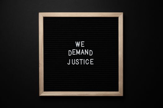 We demand justice inscription in frame
