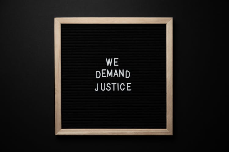 We Demand Justice Inscription In Frame