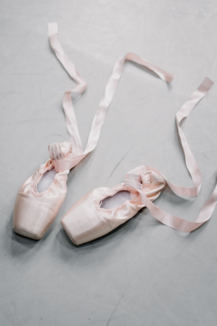 Pointe Shoes With Silk Ribbon On Floor