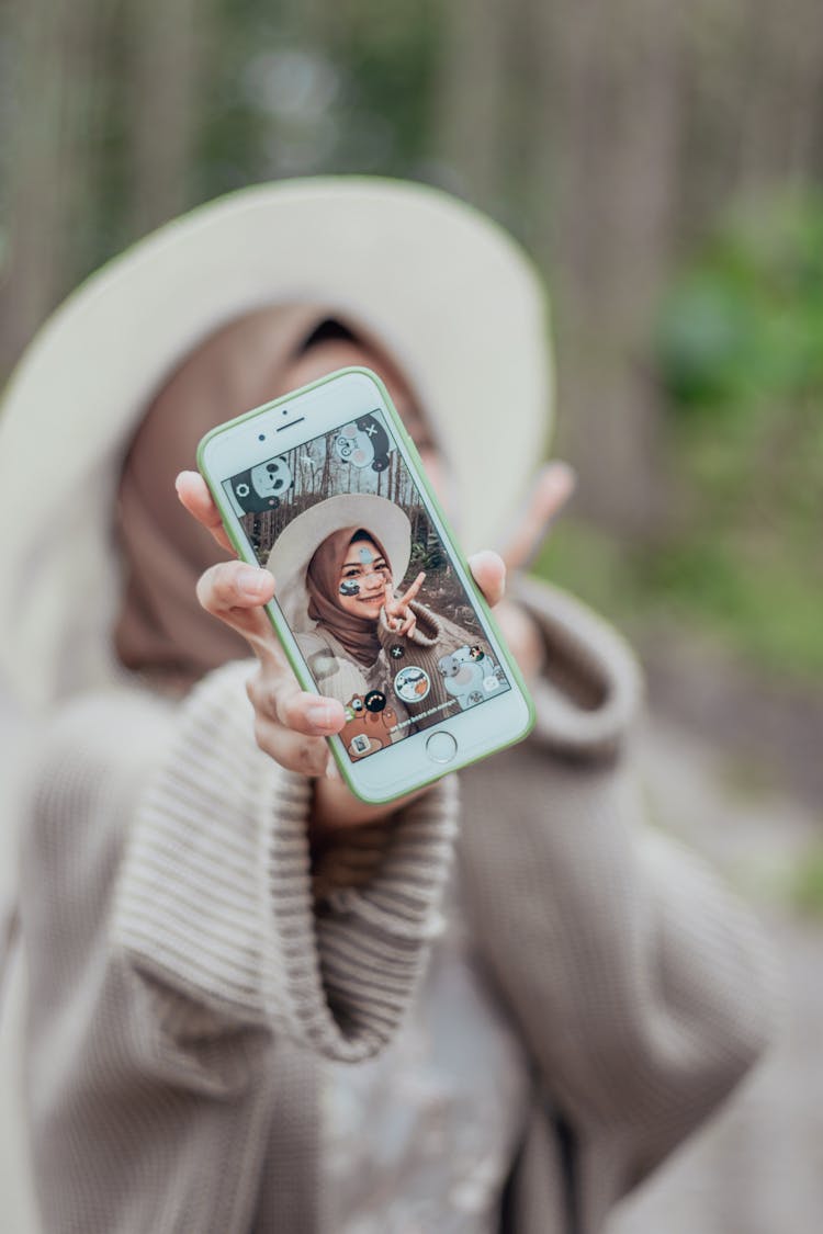 Woman Showing Her Smartphone