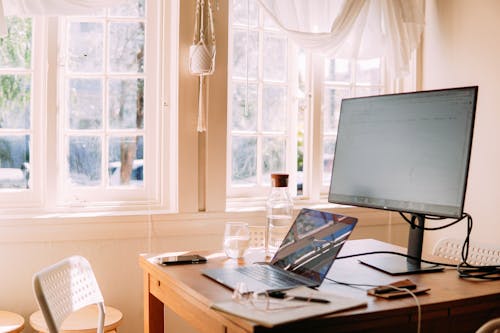 Free White Laptop and Monitor on Table Stock Photo