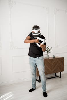 Adult man wearing virtual reality headset and playing indoors, enjoying an immersive gaming experience.