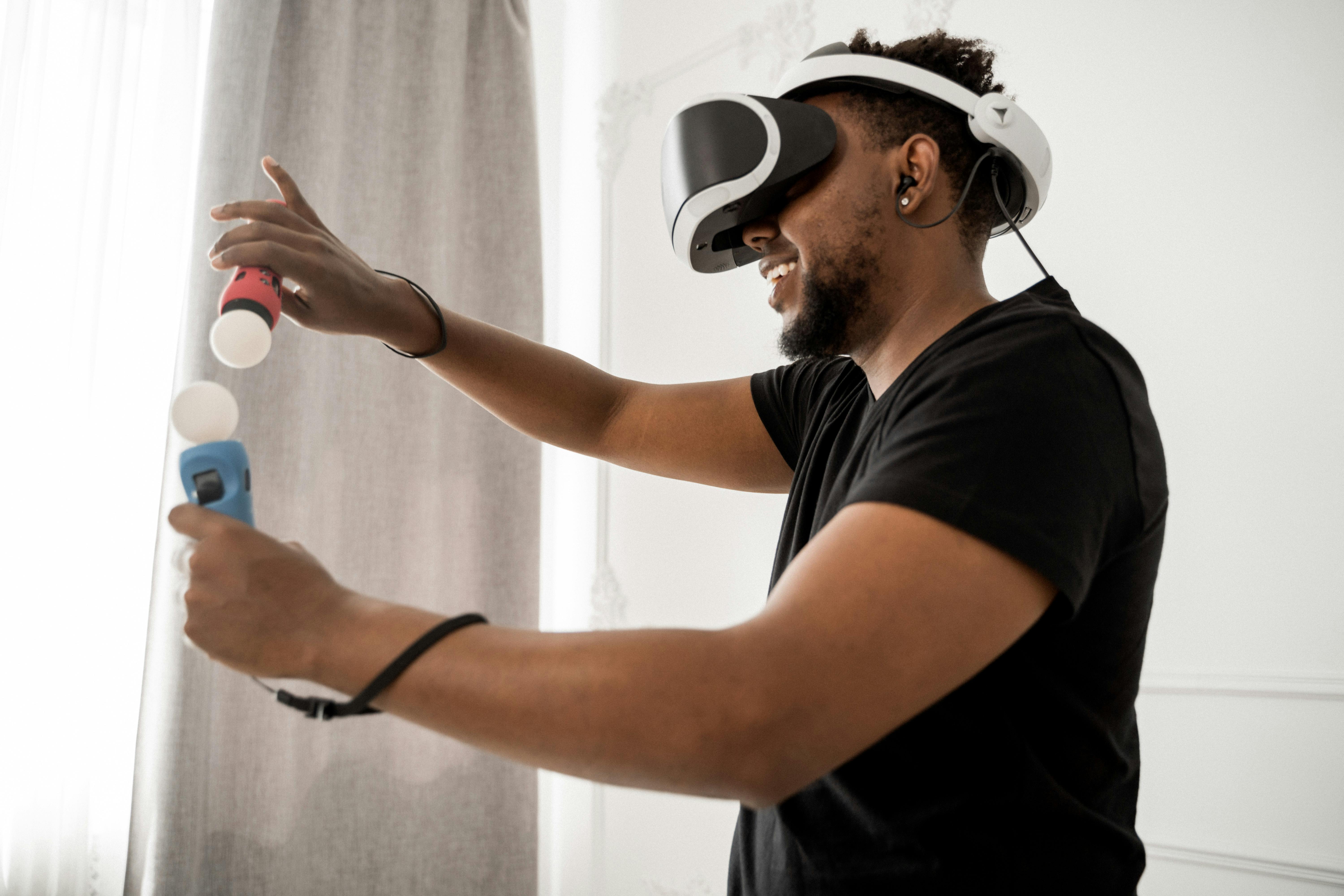 man in black crew neck t shirt wearing white and black vr goggles