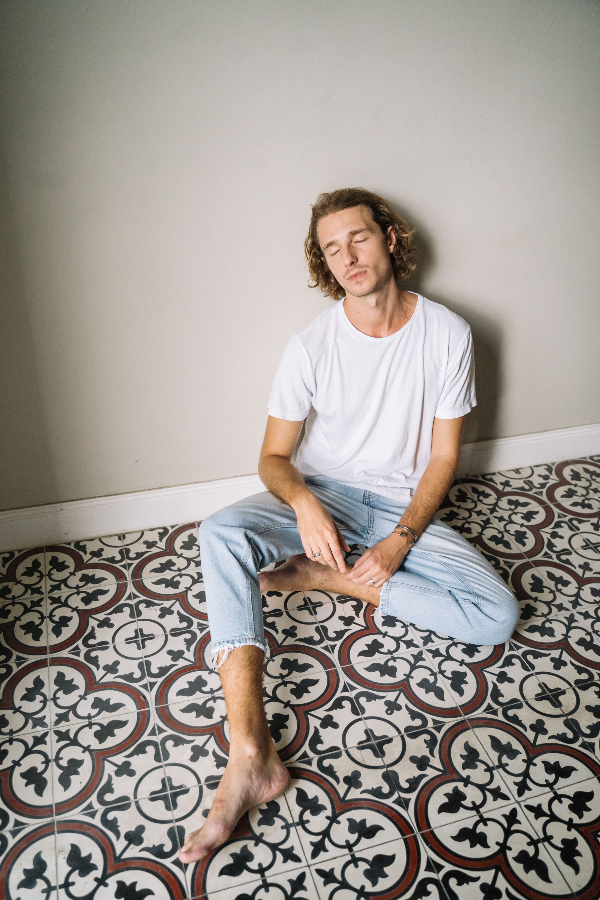 Men Wearing White Shirts and Denim 