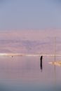 Sunset and Mountains Reflecting in a Calm Sea 