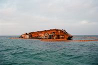 Rusty Shipwreck in a Sea 