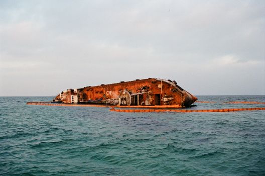 Rusty Shipwreck in a Sea 