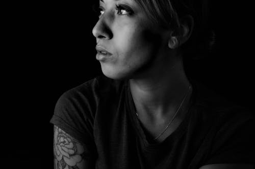 Free stock photo of arm tattoo, black and white portrait, female portrait Stock Photo