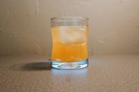 Clear Drinking Glass With Brown Liquid