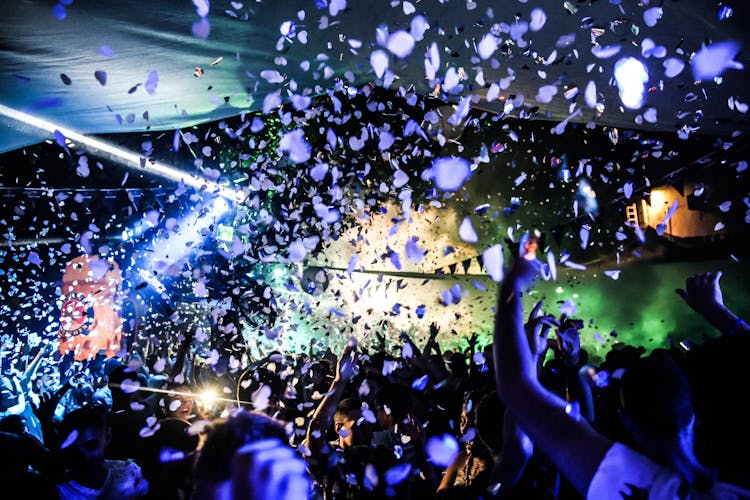 Crowd Of People Dancing On A Rave Party Inside A Nightclub