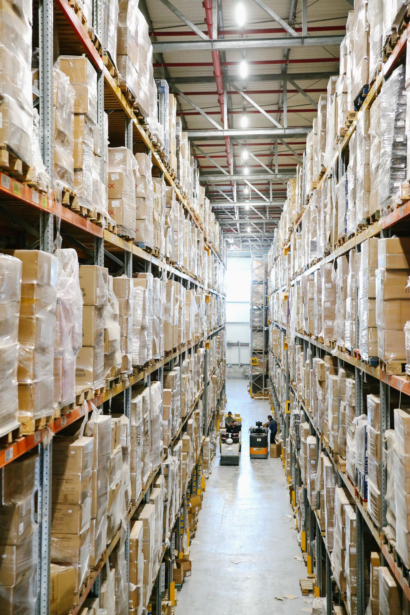 Warehouse aisle stacked with packaged goods on shelving
