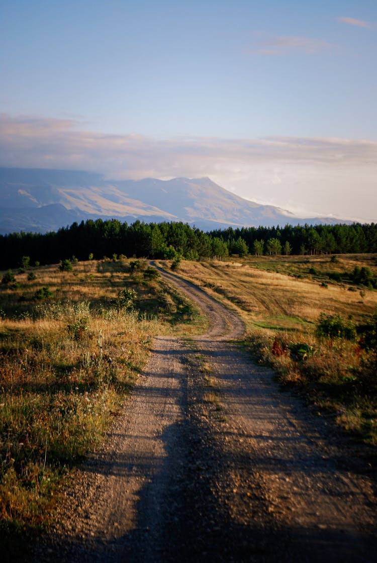 Country Road And Mountains In Distance 