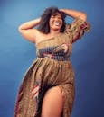 Positive plump black woman smiling happily