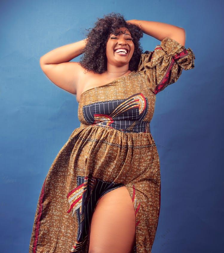 Positive Plump Black Woman Smiling Happily