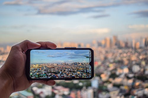 Foto profissional grátis de celular, cidade, cidades
